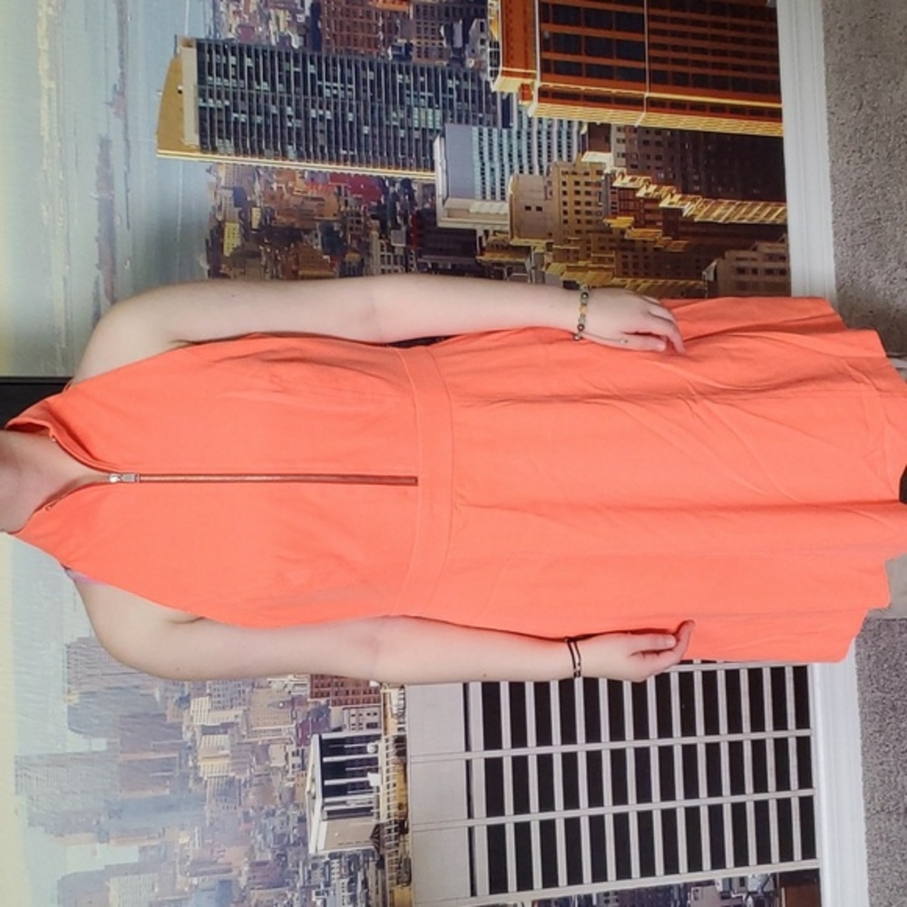 Bright neon orange & yellow woman's sleeveless dress.